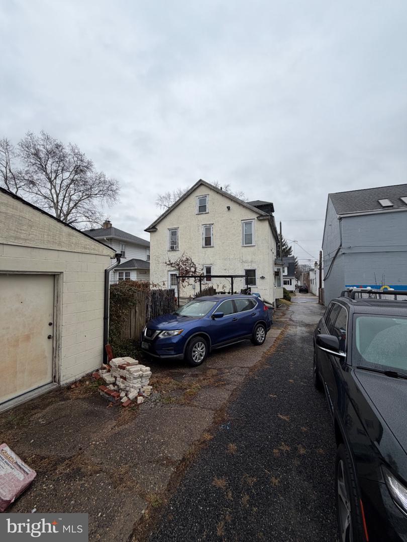 Rear and side yard of 6 N Brighton Ave before renovation