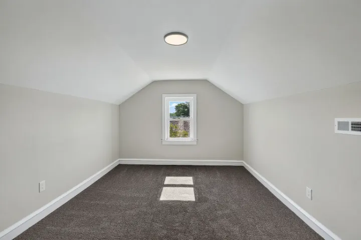 Third-floor bedroom with vaulted ceiling