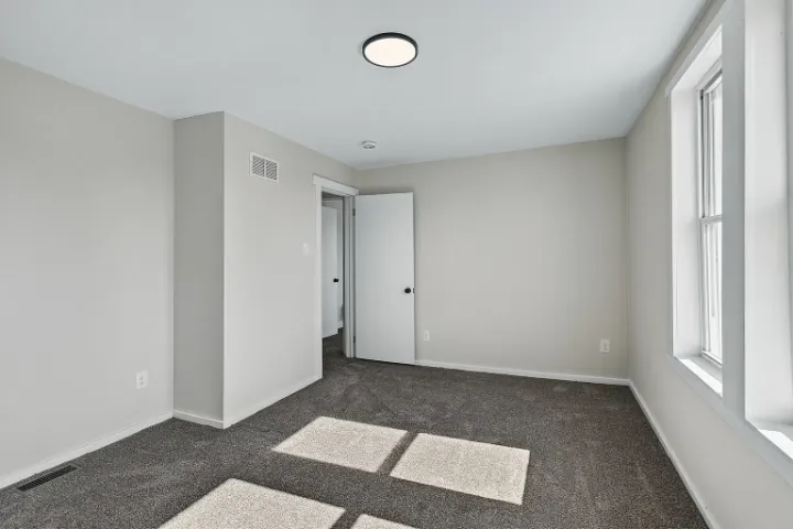 Bedroom with fresh paint and trim