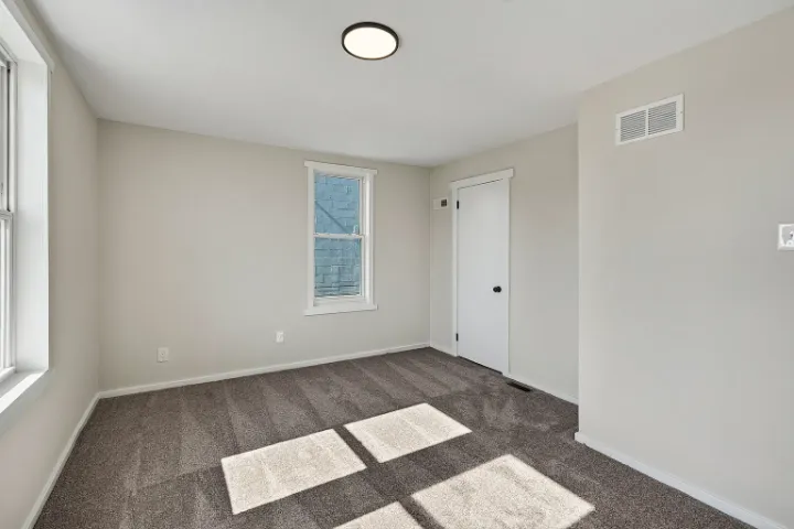 Bedroom with new overhead light