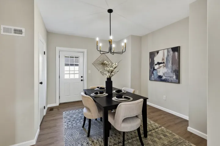 Dining room with brass-and-black chandelier