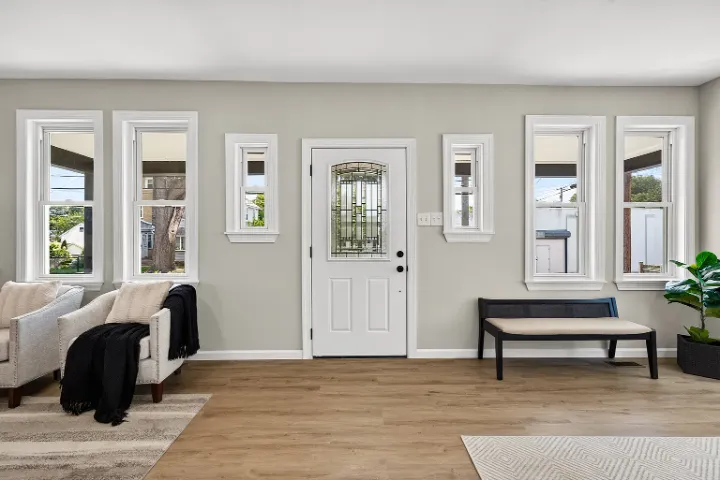 Front door wall with new trim and windows
