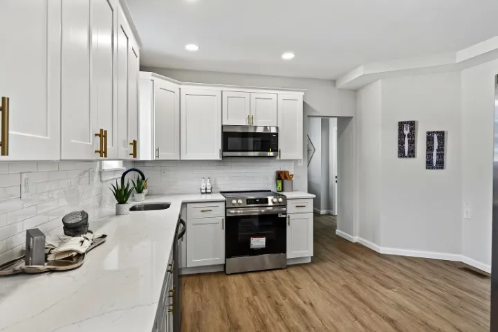 Kitchen range wall with subway-tile backsplash